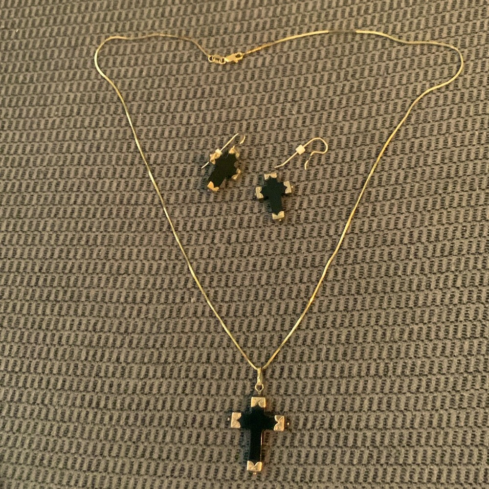 Cross necklace trimmed in gold